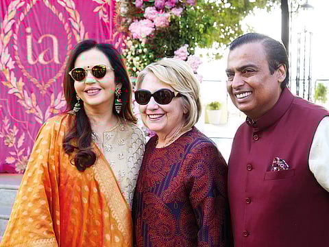 Former US Secretary of State Hillary Clinton (centre) poses with Mukesh Ambani, chairman of Reliance Industries, and his wife Nita Ambani after her arrival in Udaipur.