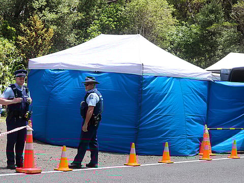 Police investigating the murder of British tourist Grace Millane stand by a cordoned off crime scene along a section of Scenic Drive in the Waitakere Ranges outside Auckland, New Zealand