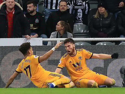 Matt Doherty (R) celebrates with Morgan Gibbs-White (L) after scoring their late winner.
