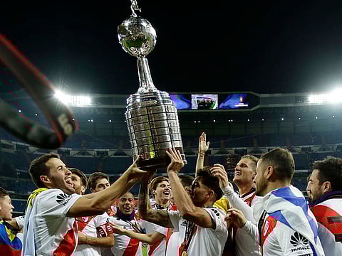 Argentina's River Plate celebrate with the trophy.