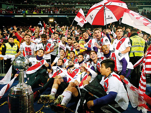 Players of Argentina’s River Plate celebrate after defeating Argentina’s Boca Juniors in the Copa Libertadores final soccer match at the Santiago Bernabeu stadium in Madrid, Spain.
