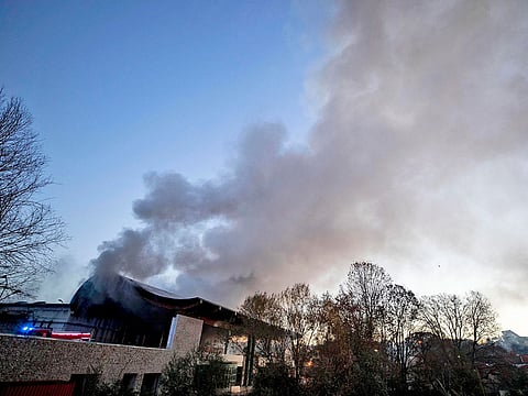 Firefighters work to estinguish a fire which broke out overnight at a garbage deposit on the outskirts of Rome, Tuesday, Dec. 11, 2018