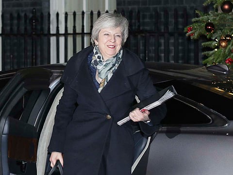 British Prime Minister Theresa May arrives at 10 Downing Street, in London, Wednesday Dec. 12, 2018.