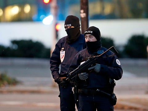 French police officers stand guard, in Strasbourg, eastern France, Thursday, Dec. 13, 2018.