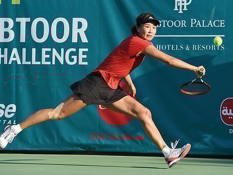 Peng Shuai stretches for a backhand shot against Viktoria Kuzmova during the 21st Al Habtoor Tennis Challenge final at the Habtoor Grand Hotel in Dubai Marina yesterday.