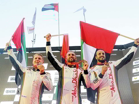 Shaun Torrente (centre) celebrates his title at the season-ending Grand Prix of Sharjah on Khalid Lagoon