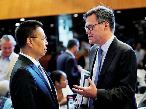Dennis Shea (right) US Ambassador to the WTO and Chinese envoy Zhang Xiangchen. The two exchanged heated texts at the start of a review of US trade policies at the WTO.