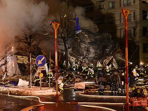 Firefighters carry on rescue works after an explosion at a restaurant in Sapporo, in the northern Hokkaido prefecture on December 16, 2018. Dozens have been injured and no casualties have been reported.
