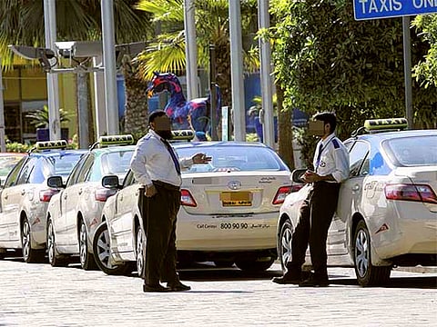 Taxi drivers wait for passengers. For illustrative purposes only.