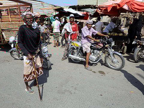 People are pictured at a market in the Red Sea city of Hodeidah, Yemen