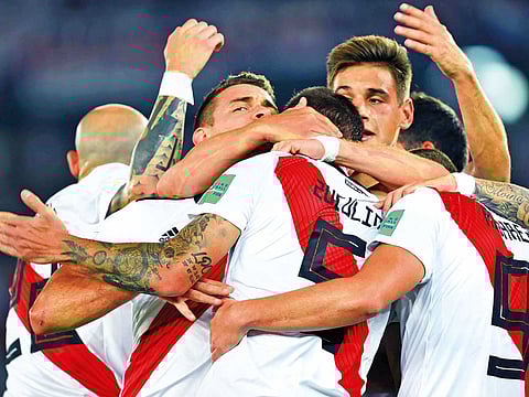 River’s Bruno Zuculini celebrates his first goal with teammates at the Zayed Sports City.