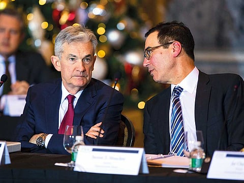 Steven Mnuchin, US Treasury Secretary (right) speaks with Jerome Powell during a Financial Stability Oversight Council meeting at the US Treasury in Washington on Wednesday.
