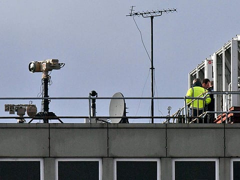 Counter drone equipment is deployed on a rooftop at Gatwick airport in Gatwick, England, Friday, Dec. 21, 2018