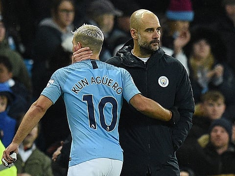 Manchester City's Spanish manager Pep Guardiola (R) consoles Manchester City's Argentinian striker Sergio Aguero (L) after the final whistle in the English Premier League football match between Manchester City and Crystal Palace at the Etihad Stadium in Manchester, north west England, on December 22, 2018. Photo for illustrative purposes only