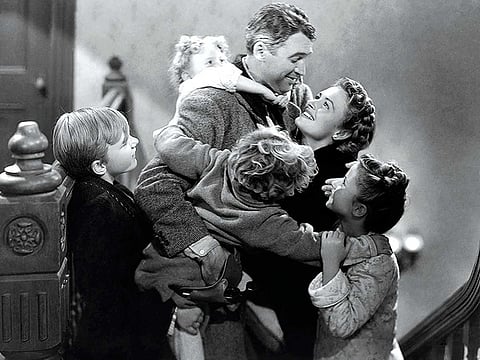 James Stewart, Donna Reed, Carol Coombs, Karolyn Grimes, Jimmy Hawkins, and Larry Simms in It’s a Wonderful Life (1946), which was voted a fan favourite among holiday films.