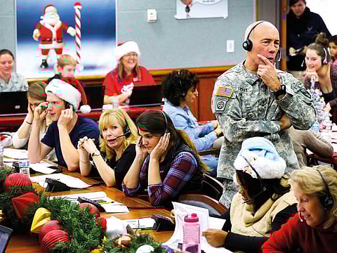 Norad Chief of Staff Maj Gen Charles D. Luckey takes a call at the Norad Tracks Santa centre at Peterson Air Force Base in Colorado Springs in this December 2014 file photo.