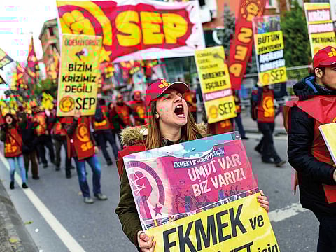 Protesters shout slogans during a demonstration against the Turkish government’s economic policies and high inflation in recent months, in Istanbul on December 22.