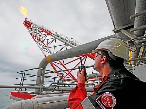 An oil platform operated by Lukoil in the Caspian Sea, Russia. Russia is cutting output as part of the Opec+ deal.