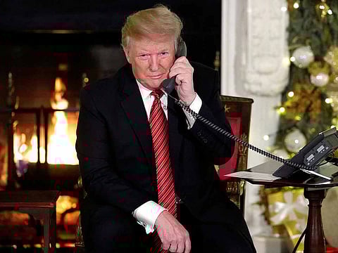 US President Donald Trump participates in NORAD Santa tracker phone calls from the White House in Washington, Dec. 24, 2018.