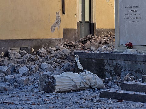 The destroyed statue of Saint Emidio, known as the protector against earthquakes, is pictured in Pennisi on December 26, 2018 after a 4.8-magnitude earthquake hit the area around Europe's most active volcano Mount Etna.
