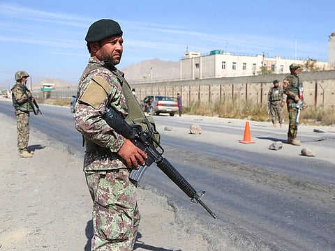 Afghan National Army soldiers stand guard at a checkpoint in Kabul, Afghanistan.