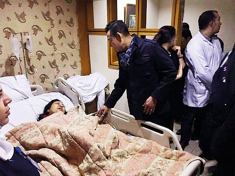 Vietnamese ambassador visits an injured Vietnamese tourist at a hospital in Cairo last Friday after a roadside bomb hit a tourist bus killing three Vietnamese and their Egyptian guide.