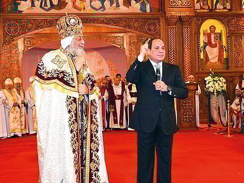 President Al Sissi speaks during a Coptic Christmas service with Coptic Pope Tawadros II in a cathedral last year.