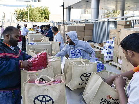 Goodie bags for participants being put together for the Gulf News Fun Drive