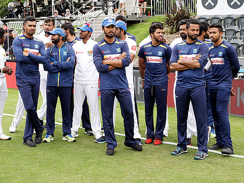 Sri Lankan team members wait during the presentation ceremony following their 423 run loss during play on the final day of the second cricket test between New Zealand and Sri Lanka at Hagley Oval in Christchurch, New Zealand, Sunday, December 30, 2018.