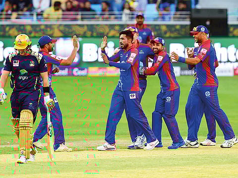 Mohammad Amir celebrating after getting wicket of Shane Watson during the Karachi Kings vs Quetta Gladiators PSL match at Dubai International Cricket Stadium.