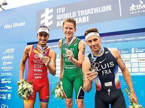 Henrl Schoeman (centre), Mario Mola (left) and Vincent Luis will all be running in Abu Dhabi