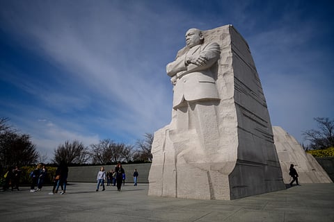 Visitors walk next to the Martin Luther King Jr. Memorial in Washington, DC