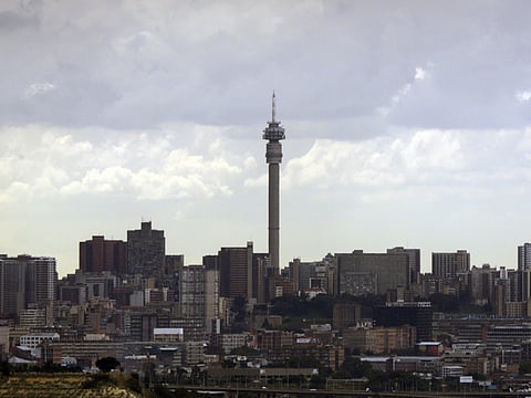 Johannesburg's skyline is shown under the clouds in South Africa.
