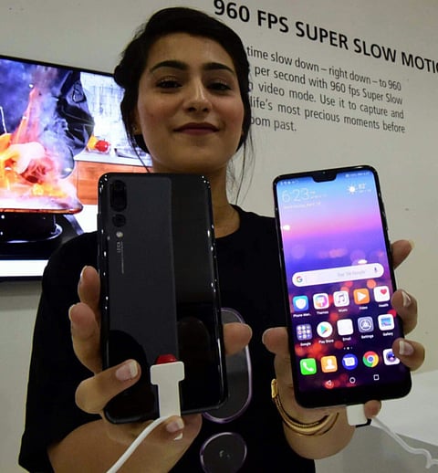 Huawei launches two flagships to take on Apple and Samsung