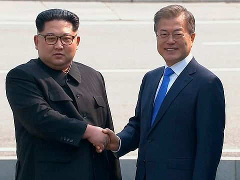 File picture: North Korean leader Kim Jong Un, left, shakes hands with South Korean President Moon Jae-in as Kim crossed the border into South Korea for their historic face-to-face talks, in Panmunjom.