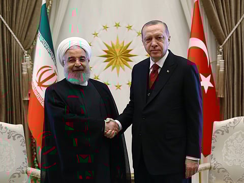 File 2018 picture shows Iranian President Hassan Rouhani (left) with Turkish President Recep Tayyip Erdogan