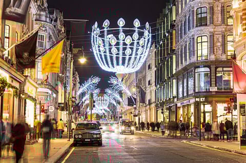 Millions of people must cancel their Christmas get-togethers and most shops have to close in London and much of southern England, says British Prime Minister Boris Johnson.