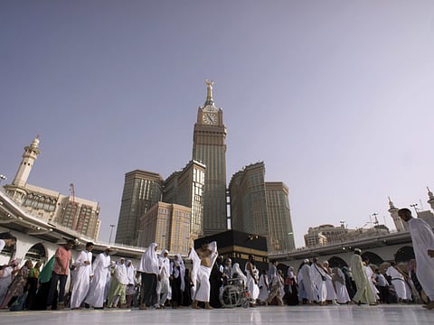 Muslim pilgrims walk around the Kaaba, the cubic building at the Grand Mosque, during the minor pilgrimage, known as Umrah, in the Muslim holy city of Mecca, Saudi Arabia, Friday, May 4, 2018.