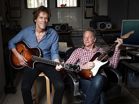In this May 28, 2018 photo, brothers Kevin Bacon, left, and Michael Bacon pose in New York.