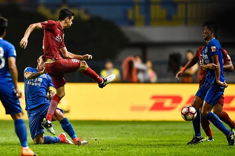 Shanghai SIPG’s Oscar (in red), Asia's most expensive footballer, will be in action at the AFC Champions League East in Qatar.