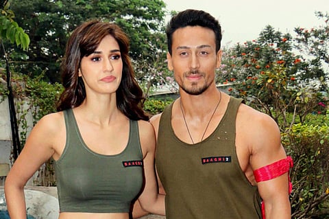 Mumbai: Bollywood actors Disha Patani and Tiger Shroff pose for a photo during a promotion of their upcoming film 'Baaghi 2' on the sets of a dance reality show, in Mumbai on Thursday. PTI Photo (PTI3_16_2018_000103B)