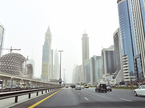Dusty skies conceal the beautiful Dubai skyline in the distance.