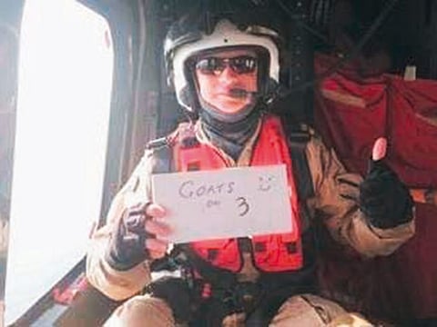 Paramedic Mark Roxburgh holds up a placard saying ‘Goats on 3’, which was his former rugby club RAK Goat’s war cry.