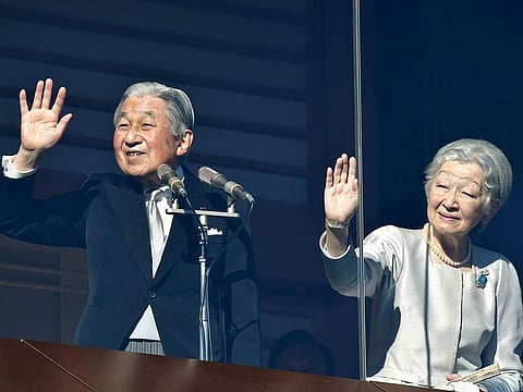 Japan's Emperor Akihito and Empress Michiko wave to well-wishers at the Imperial Palace in Tokyo on January 2, 2019 during New Year's greetings.