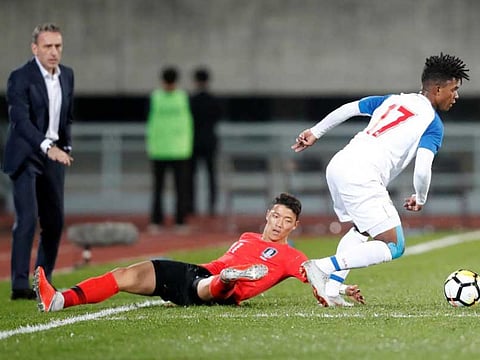 File photo show an international friendly between South Korea v Panama, in Cheonan Stadium, Cheonan, South Korea - October 16, 2018 South Korea's Hwang Hee-Chan in action with Panama's Luis Ovalle as South Korea coach Paulo Bento looks on.