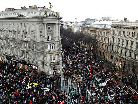 People take part in a protest against a proposed new labor law, billed as the "slave law", in Budapest, Hungary,