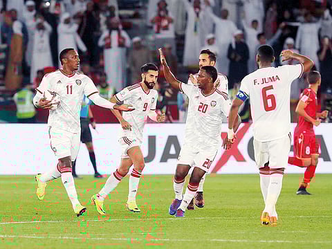 UAE forward Ahmad Khalil (second from left) celebrates after scoring a goal during the Asian Cup match against Bahrain at the Zayed Sports City stadium in Abu Dhabi on Saturday.