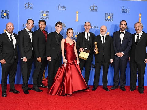 The cast and crew of "The Americans" pose in the press room with the award for best television series, drama at the 76th annual Golden Globe Awards at the Beverly Hilton Hotel.