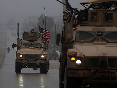 A line of US military vehicles in Syria's northern city of Manbij.