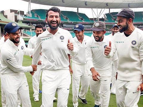 Cheteshwar Pujara, the Man of the Series, dances as India celebrate their series win over Australia after play was called off on the fifth day in Sydney Cricket Ground on Monday.